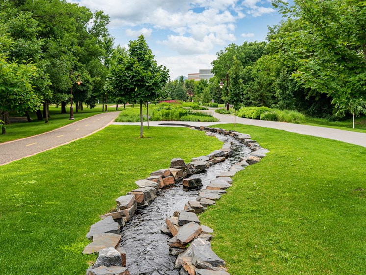 Stone water feature along a promenade/bike trail